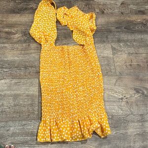Yellow halter backless dress with white flowers. Size: S
